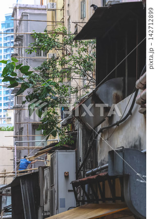 Hong Kong Aug 29 2026 alleyway behind residential buildings in Fung Tak Hong Kong Aug 29 2026 alleyway behind residential buildings in Fung Tak 142712899