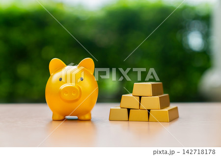 close up of piggy bank on wood table close up of piggy bank on wood table 142718178