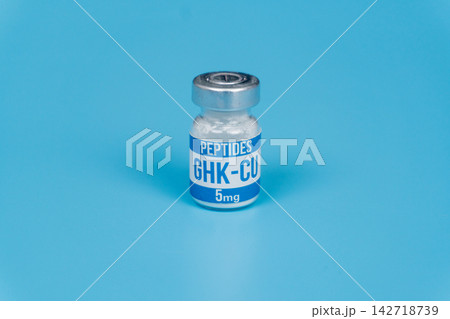 GHK-CU Peptide Vial 5mg on Blue Background, Studio Product Shot 142718739