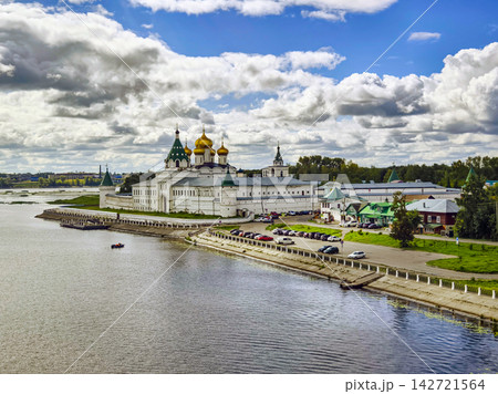 Historic monastery on the riverbank under a cloudy sky in Russia 142721564