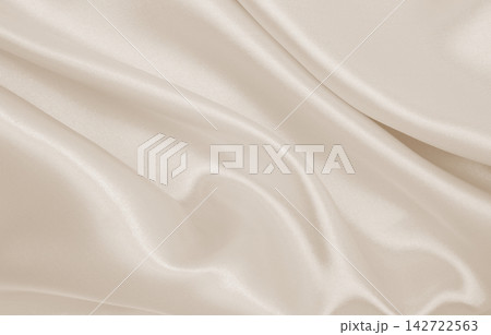 Smooth elegant golden silk or satin luxury cloth texture as wedding background. Luxurious background design. In Sepia toned. Retro style Smooth elegant golden silk or satin luxury cloth texture as wedding background. Luxurious background design. In Sepia toned. Retro style 142722563