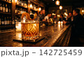 Cinematic photography of a premium Old Fashioned whiskey cocktail in a crystal glass with warm lighting. 142725459