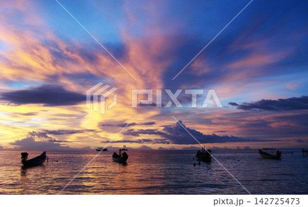 fishermen fishing at sunset 142725473