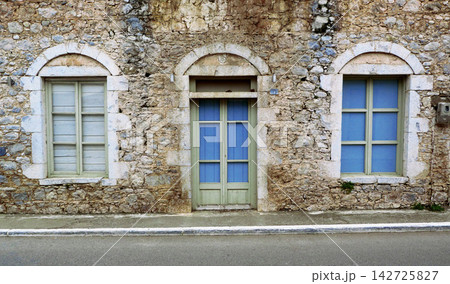old windows on the wall of the old house old windows on the wall of the old house 142725827