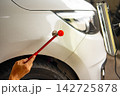 Removing dents on the car. PDR technology. Car body repair without painting. 142725878