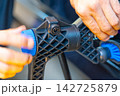 Removing dents on the car. PDR technology. Car body repair without painting. 142725879