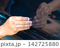 Removing dents on the car. PDR technology. Car body repair without painting. 142725880
