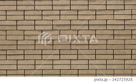 A smooth, neat wall made of modern beige or light-sand-colored facing brick. The rectangular blocks are laid in a staggered pattern. Dark horizontal and vertical joints accentuate the geometry. 142725928
