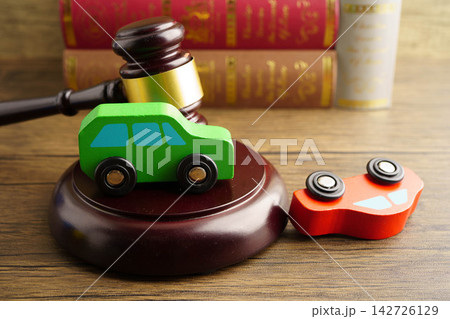 Car accident lawsuit and insurance, Judge hammer with car model. 142726129