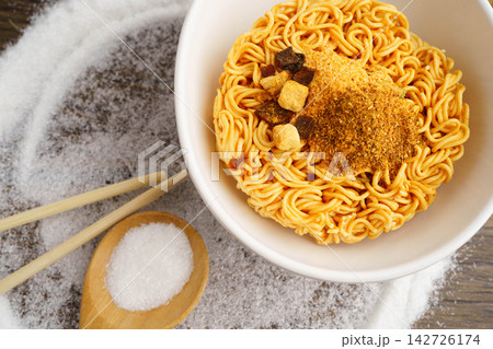 Instant noodles dry junk food with high sodium. Instant noodles dry junk food with high sodium. 142726174
