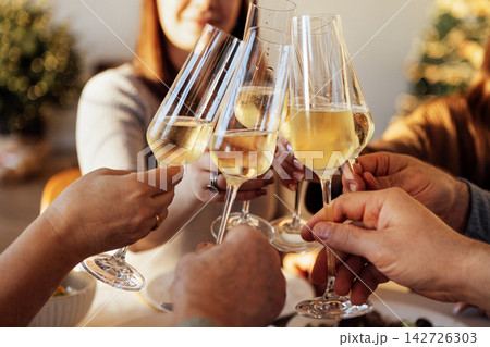 A happy big family at the dining table in the dining room at home 142726303