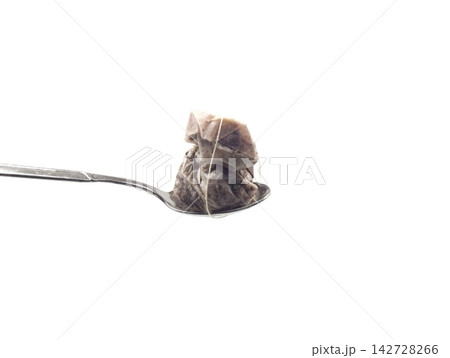 used tea bag on spoon used tea bag on spoon 142728266