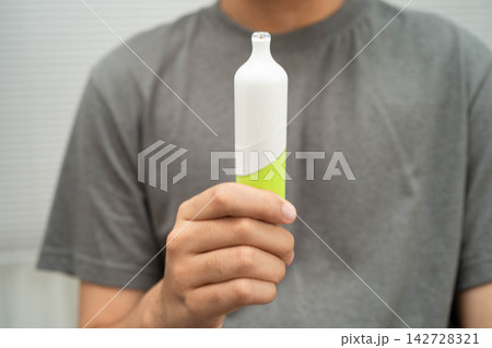Man holding electronic cigarettes, no smoking. Man holding electronic cigarettes, no smoking. 142728321