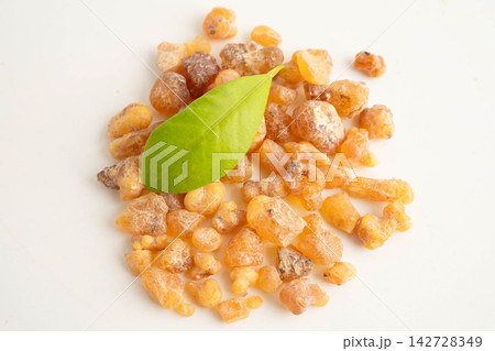 Frankincense or olibanum aromatic resin isolated on white background used in incense and perfumes. Frankincense or olibanum aromatic resin isolated on white background used in incense and perfumes. 142728349
