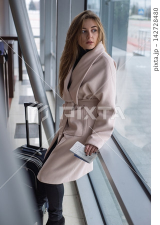 Portrait of young elegant businesswoman at the airport. 142728480