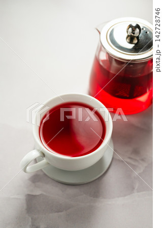 Hot fruit tea with minimalist cozy still life, in minimalist setting with copy space 142728746