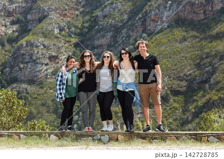 Friends, portrait and hug in outdoor nature, adventure and bonding for love on vacation for freedom. Happy people, embrace and hiking on weekend trip or holiday, travel and together for relationship 142728785