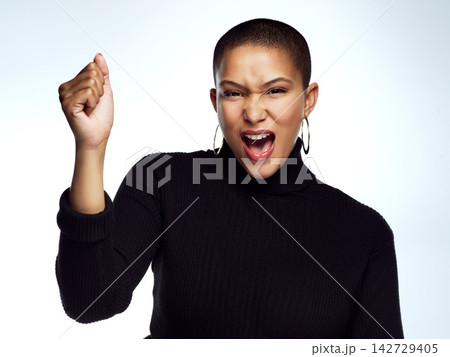 Portrait, fist and woman with celebration, winning and achievement on grey studio background. Face, person and winner with hand gesture, giveaway prize and girl power with success, excited and bonus 142729405