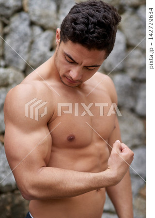 Man, shirtless and flex with bicep for strong bodybuilder, exercise and fitness in nature. Male athlete, workout and arm with muscle for wellness, training or healthy for sport with weight lifting Man, shirtless and flex with bicep for strong bodybuilder, exercise and fitness in nature. Male athlete, workout and arm with muscle for wellness, training or healthy for sport with weight lifting 142729634