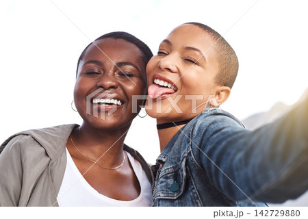 Silly, selfie and girl friends in city together for vacation, holiday or adventure travel. Happy, outdoor and young women with photography picture for goofy memory in urban town on weekend trip. Silly, selfie and girl friends in city together for vacation, holiday or adventure travel. Happy, outdoor and young women with photography picture for goofy memory in urban town on weekend trip. 142729880