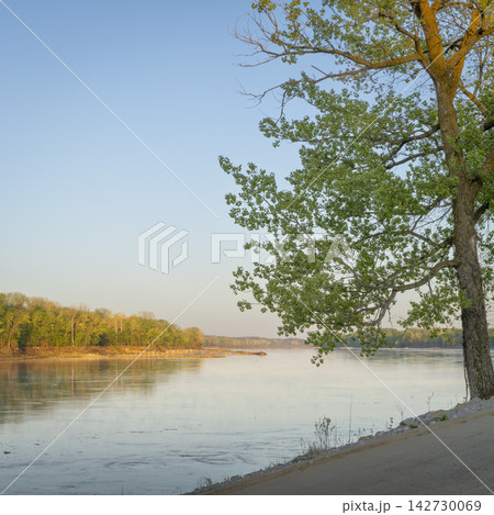 calm spring sunrise over Missouri River at Dalton Bottoms boat ramp calm spring sunrise over Missouri River at Dalton Bottoms boat ramp 142730069