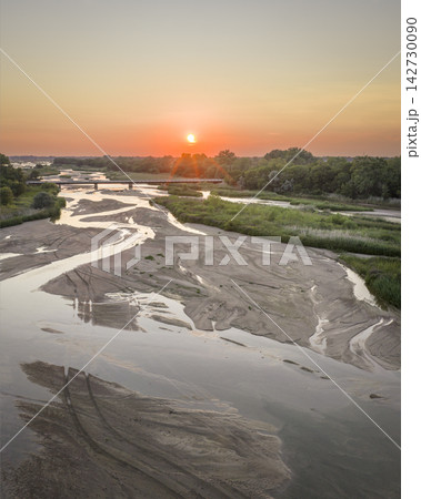 summer sunset over the Platte River and plains near Kerney, Nebraska summer sunset over the Platte River and plains near Kerney, Nebraska 142730090