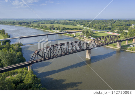 Highway and railroad bridges across the Missouri RIver at Rulo, Nebraska, summer aerial view Highway and railroad bridges across the Missouri RIver at Rulo, Nebraska, summer aerial view 142730098