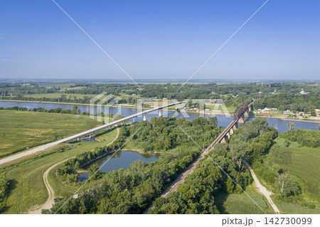 Highway and railroad bridges across the Missouri RIver at Rulo, Nebraska, summer aerial view Highway and railroad bridges across the Missouri RIver at Rulo, Nebraska, summer aerial view 142730099