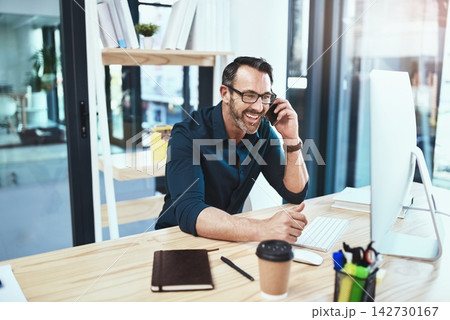 Communication, phone call and business man by desk for conversation, negotiation deal or architecture. Talking, contact and employee in office for networking, client b2b or explaining project details 142730167