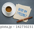 What Am I Missing? Thought provoking handwritten question on a napkin with coffee and pen, encouraging self-reflection, awareness, curiosity, and personal growth. 142730231