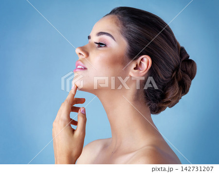 Relax, makeup and profile of woman in studio with natural beauty, confidence and luxury cosmetics. Dermatology, thinking and girl with facial care, skincare glow and healthy skin on blue background. Relax, makeup and profile of woman in studio with natural beauty, confidence and luxury cosmetics. Dermatology, thinking and girl with facial care, skincare glow and healthy skin on blue background. 142731207