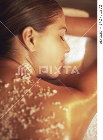 Massage, salt and exfoliate for woman for treatment, face and beauty salon for skincare and relax. Back, body scrub and smile for female person, cosmetic or zen for stress relief and holistic therapy 142731272