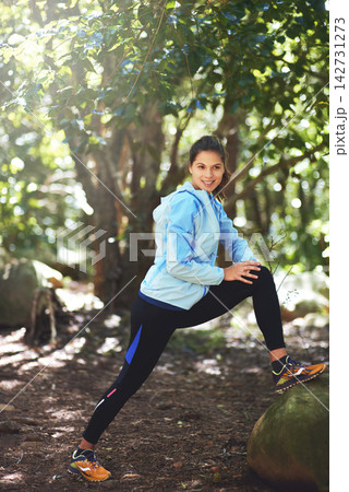 Fitness, woman and stretch for hike or exercise on trail run for workout goals or running challenge. Smile, female person and health with warm up for marathon training and cardio outdoor in nature Fitness, woman and stretch for hike or exercise on trail run for workout goals or running challenge. Smile, female person and health with warm up for marathon training and cardio outdoor in nature 142731273