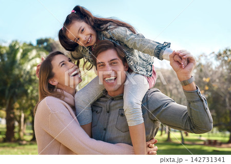 Family, parents and girl in park for piggyback, playing and bonding together with smile. Happy people, mother and father with child outdoor in nature for relaxing, recreation or physical activity Family, parents and girl in park for piggyback, playing and bonding together with smile. Happy people, mother and father with child outdoor in nature for relaxing, recreation or physical activity 142731341