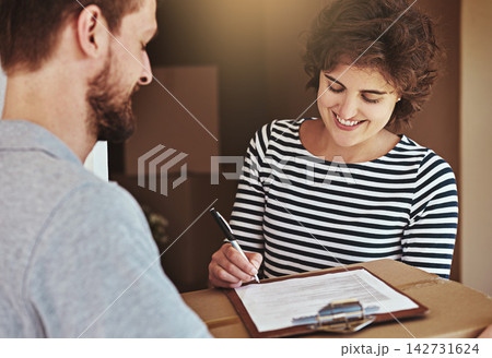 Woman, home and smile with signing for delivery or package, parcel and courier with moving in. Female person, new house and boxes with paperwork or document for shipment, mail and cargo with contract Woman, home and smile with signing for delivery or package, parcel and courier with moving in. Female person, new house and boxes with paperwork or document for shipment, mail and cargo with contract 142731624