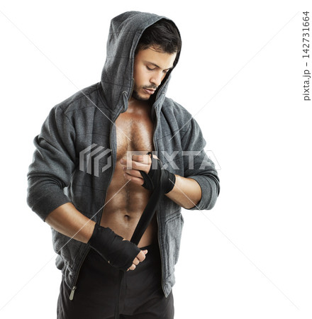 Healthy, athlete or boxer with hand wrap in studio background for fight, practice and exercise or workout. Muscle, man and hoodie on for strength, training and cardio or combat sport isolated white 142731664