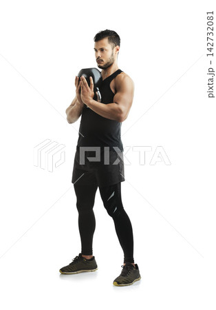 Fitness, kettlebell and man in studio for workout with arm strength for muscle training. Sports, athlete and male body builder with exercise equipment for weightlifting isolated by white background. Fitness, kettlebell and man in studio for workout with arm strength for muscle training. Sports, athlete and male body builder with exercise equipment for weightlifting isolated by white background. 142732081