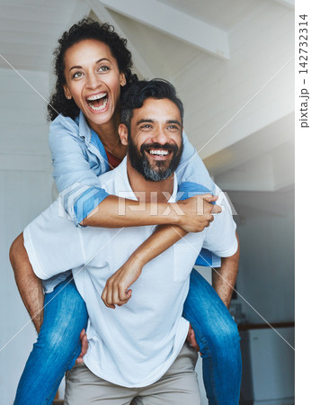 Couple, people and happy in home with piggyback to relax for bonding, love and support on break together. Smile, relationship and romance with fun or laugh as family, soulmate and care or enjoy 142732314