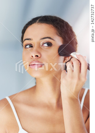 Beauty, makeup brush and black woman on cheek in bathroom for cosmetics, grooming or foundation. Powder, hand and female person with tools for applying contour, glowing skin or getting ready in home Beauty, makeup brush and black woman on cheek in bathroom for cosmetics, grooming or foundation. Powder, hand and female person with tools for applying contour, glowing skin or getting ready in home 142732737
