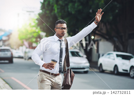 Business, travel and man with hand for taxi, attention and public transport in city on morning work commute. Bus, stop or person with coffee cup on sidewalk for calling car or waiting for cab in road 142732811