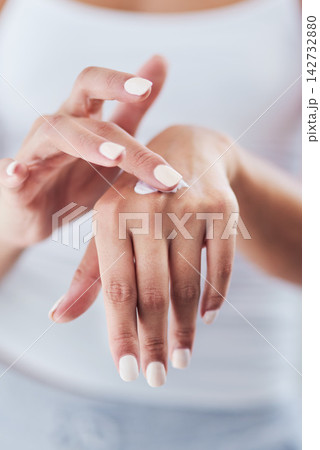 Home, hands and woman with cream, skincare and beauty with moisturizer, grooming routine and treatment. Closeup, apartment and person in bathroom, manicure and apply lotion with healthy dermatology Home, hands and woman with cream, skincare and beauty with moisturizer, grooming routine and treatment. Closeup, apartment and person in bathroom, manicure and apply lotion with healthy dermatology 142732880