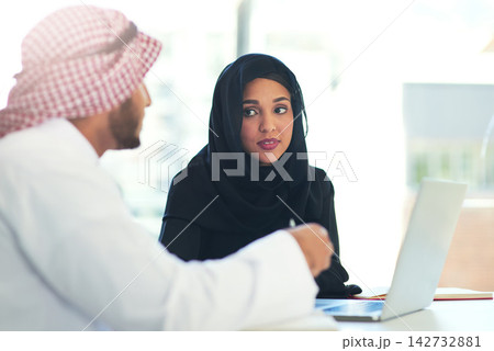 Muslim, people and teamwork conversation in office and mentor help with project on laptop in Dubai. Arab, man and woman in business training or learning for collaboration with professional advice Muslim, people and teamwork conversation in office and mentor help with project on laptop in Dubai. Arab, man and woman in business training or learning for collaboration with professional advice 142732881
