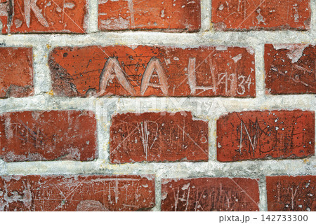 Zoom, red and old brick wall for building or concrete material for architecture, texture and surface. Stone, masonry and clay or cement to hold or plaster together for construction and design. 142733300