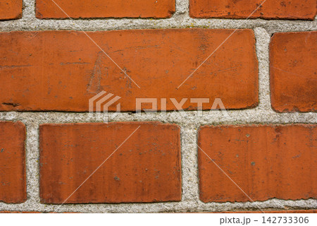 Building, design and closeup of red, brick wall for texture, background and pattern of exterior structure. Architecture, construction and surface of material, concrete and cement for decoration 142733306