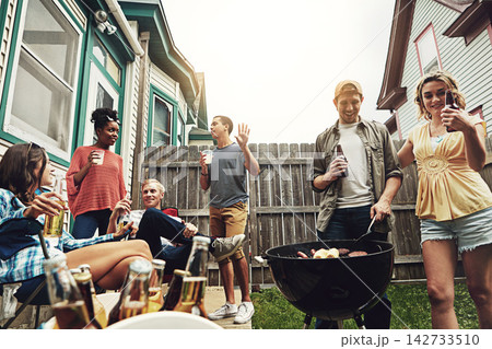 Friends, group and alcohol in backyard with bbq for social event, party and celebration with talking in home. People, drinking beer and food with relax, conversation and diversity at barbecue reunion Friends, group and alcohol in backyard with bbq for social event, party and celebration with talking in home. People, drinking beer and food with relax, conversation and diversity at barbecue reunion 142733510