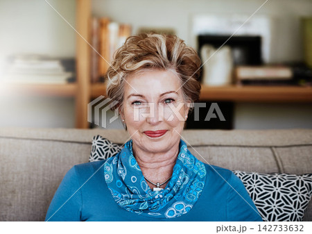 Portrait, mature and woman for relax on sofa at house with smile, relaxing and peace in calm living room. Confident, grandmother and couch in lounge with care, retirement and wellness with wrinkles 142733632