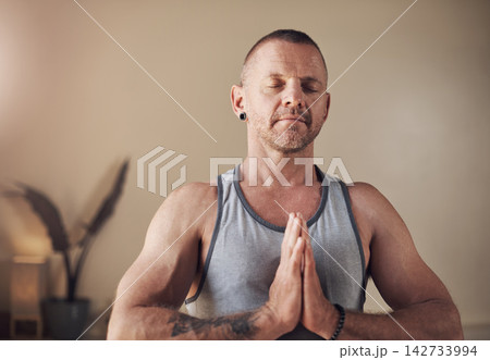 Yoga, man and namaste for exercise, breathing and spiritual awareness or reiki balance. Male person, self care and healing aura for mental health or relax in studio, mindfulness and peace or calm Yoga, man and namaste for exercise, breathing and spiritual awareness or reiki balance. Male person, self care and healing aura for mental health or relax in studio, mindfulness and peace or calm 142733994