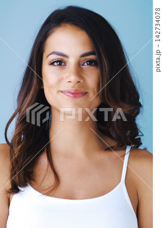 Portrait, skincare and woman in studio for hair care, beauty and glow isolated on blue background. Face, hairstyle and model in makeup cosmetics at hairdresser for shine, wellness and dermatology Portrait, skincare and woman in studio for hair care, beauty and glow isolated on blue background. Face, hairstyle and model in makeup cosmetics at hairdresser for shine, wellness and dermatology 142734078