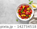 Salad with fresh sweet corn, cherry tomatoes, basil and olive oil 142734518