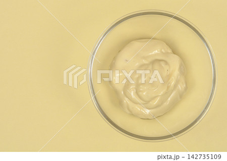 Homemade creamy mayonnaise in a glass bowl Homemade creamy mayonnaise in a glass bowl 142735109